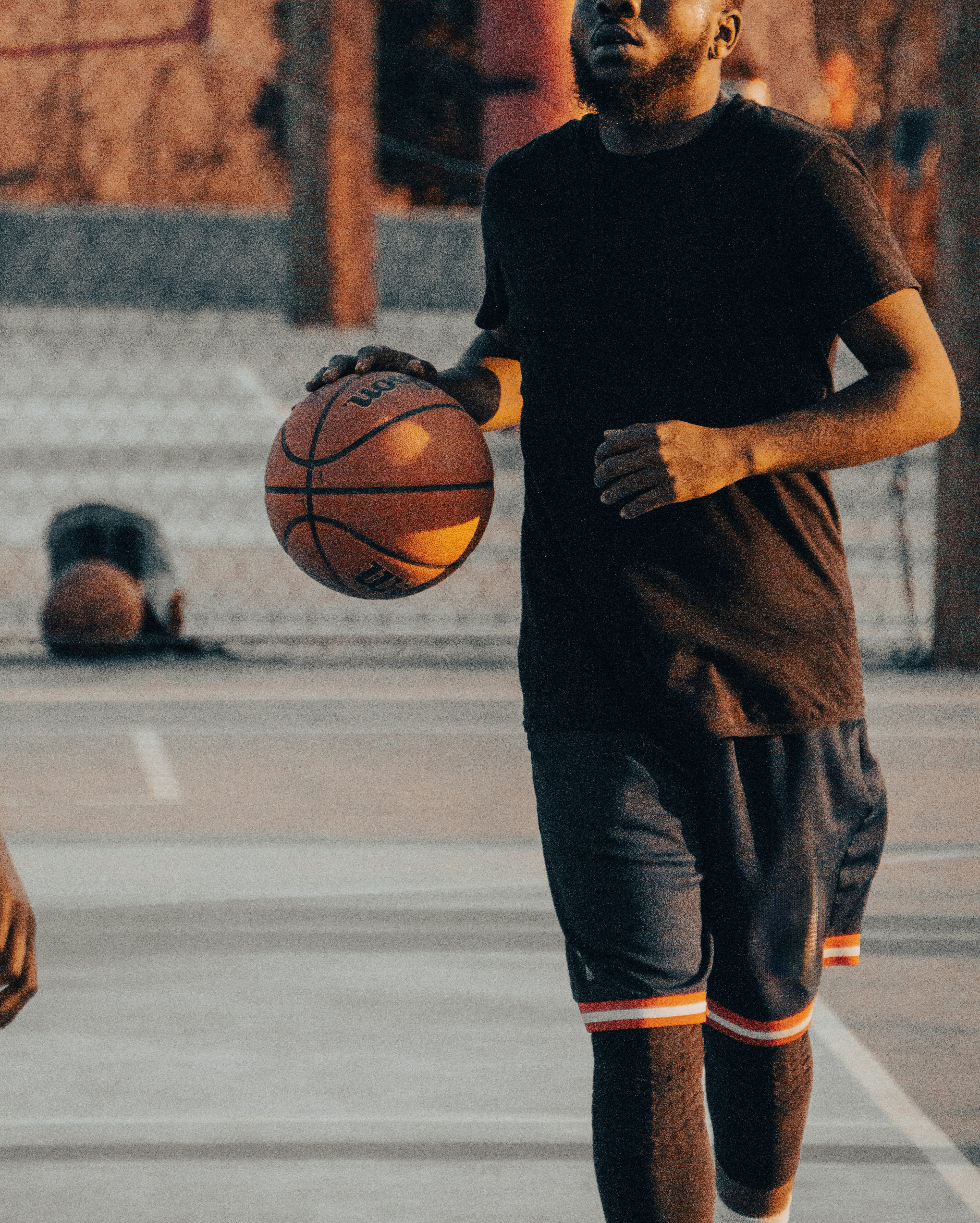 Basketball player holding ball at playground